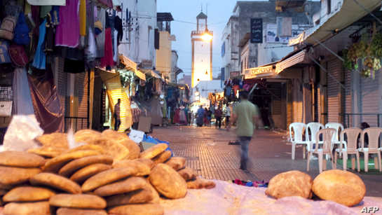 TO GO WITH AFP STORY by Simon Martelli
A picture taken on August 10, 2012 shows a street of the medina in Rabat during Ramadan. The seats outside cafes are empty and streets eerily quiet in the hour before sunset, as Moroccans wait to break the day-long Ramadan fast. But one group is causing a stir by flouting religious convention. Masayminch ("We're not fasting" in the local Arabic dialect) was founded last month by Moroccan youths seeking to defend individual liberties, starting with the right of non-believers to eat, drink or smoke in public during the Muslim holy month. AFP PHOTO / FADEL SENNA (Photo by FADEL SENNA / AFP)