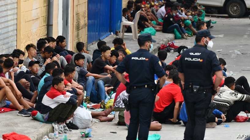 Migrant minors wait to be tested for COVID-19 upon their arrival to the Spanish enclave of Ceuta, on May 19, 2021. - Migrants were still trying to cross from Morocco into the Spanish enclave of Ceuta after a record 8,000 people poured over the border this week, escalating tensions between Rabat and Madrid. (Photo by Antonio Sempere / AFP) / Restricted to editorial use - To illustrate the event as specified in the caption
