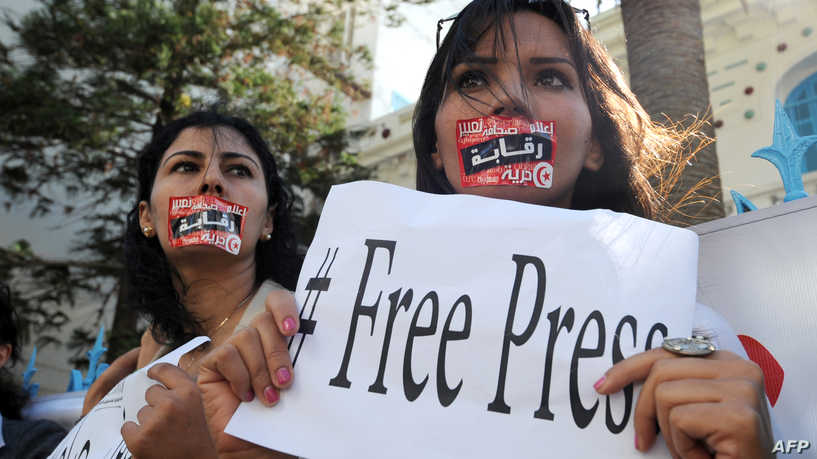 Tunisian Journalists protest during a strike on October 17, 2012 in the capital Tunis, after months of rising tensions with the Islamist-led government, which is accused of curbing press freedom and seeking to control public media groups. AFP PHOTO / FETHI BELAID / AFP PHOTO / FETHI BELAID