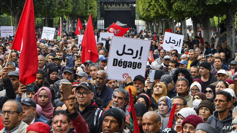 Tunisian demonstrators take part in a rally against President Kais Saied, called for by the opposition "National Salvation Front" coalition, in the capital Tunis, on December 10, 2022. (Photo by FETHI BELAID / AFP)