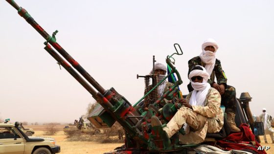 An anti aircraft gun is seen mounted on the back of a pick up truck as militants from the Movement for the Salvation of Azawad (MSA), a Tuareg political and armed movement in the Azawad Region in Mali, gather in the desert outside Menaka on March 14, 2020 during the MSA congress. (Photo by Souleymane Ag Anara / AFP)