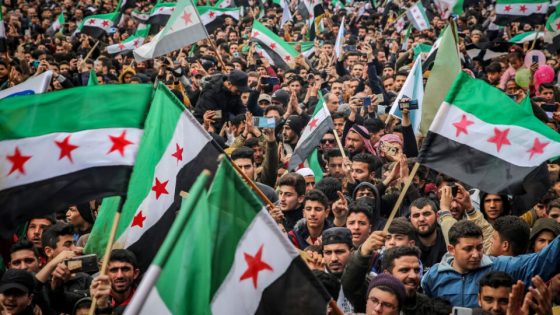 IDLIB, SYRIA - MARCH 15: Syrians stage a demonstration against Bashar al-Assad regime within the 12th anniversary of the Syrian Civil War in Idlib, Syria on March 15, 2023. As the Syrian civil war, which has cost hundreds of thousands of lives, hits the 12-year mark, the attacks of the Bashar al-Assad regime and its supporters have inflicted deep wounds on millions of civilians. (Photo by Mohammed Said/Anadolu Agency via Getty Images)