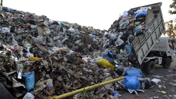 epa05006276 A pick-up truck unloads garbage at a temporary dump on the edge of Beirut river, Lebanon, 01 November 2015. The garbage collection crisis erupted in Beirut on July 17 after the capital's overflowing landfill was closed. The crisis has allowed piles of garbage to accumulate, covering most streets across the capital and Mount Lebanon. EPA/WAEL HAMZEH